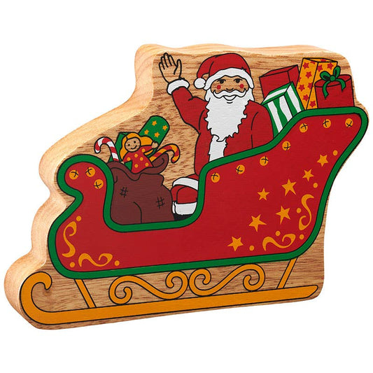 Wooden Christmas decoration with Santa Claus in a sleigh, surrounded by presents.